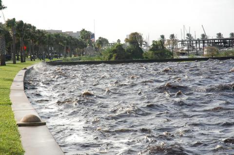 Waves lap at the top of the Lake Monroe seawall as recent rainfall has raised water levels, causing flooding in parts of Sanford. 